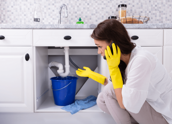 woman calling a plumber